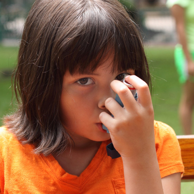 girl with asthma puffer