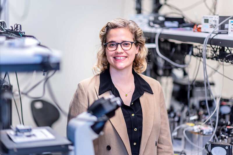 blonde femal scientist standing in lab
