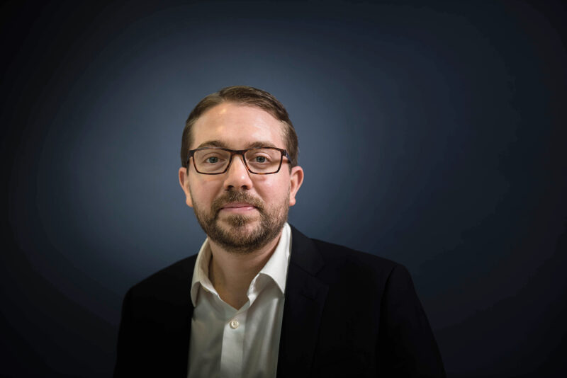 caucasian man wearing glasses